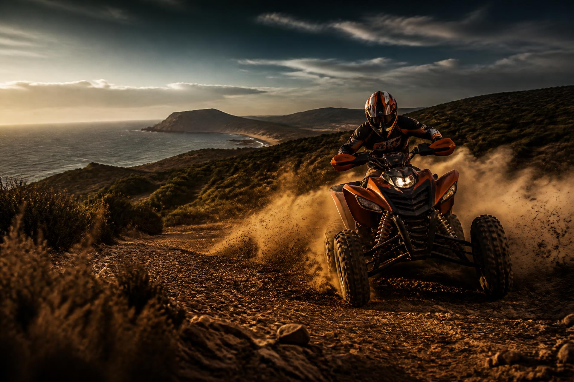 Quad en pleine accélération dans la poussière face à la Méditerranée